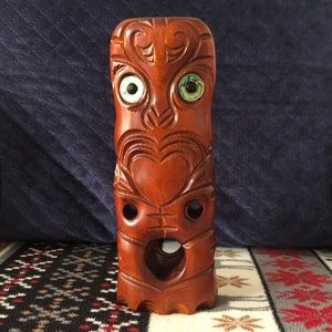 Authentic antique Māori carved tiki or teko with Paua shell eyes.